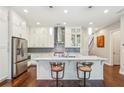 Beautiful kitchen with stainless appliances, white cabinets, and hardwood floors at 828 Canterbury Overlook Ne, Atlanta, GA 30324