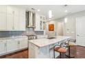 Spacious kitchen featuring granite countertops, stainless steel appliances, and a central island with seating at 828 Canterbury Overlook Ne, Atlanta, GA 30324