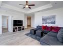 Spacious living room with hardwood floors, sectional sofa, and modern entertainment center at 325 E Paces Ferry Ne Rd # 1405, Atlanta, GA 30305