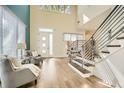 Sunlit entryway with a modern staircase featuring stylish railings and light wood floors at 4225 Maner Se St, Smyrna, GA 30080