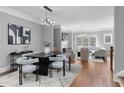 Contemporary dining area with stylish table, seating, and an adjacent living space at 2528 Magnolia Ridge Dr, Marietta, GA 30067