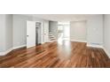 Bright living area featuring hardwood floors, neutral gray walls, and staircase access to upper level at 6331 Wedgeview Dr, Tucker, GA 30084