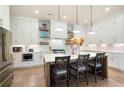 Gourmet kitchen with white cabinetry, quartz countertops, stainless steel appliances, and a stylish island at 920 Wemberley Ln, Marietta, GA 30064