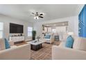 Bright living room featuring hardwood floors and an open-concept design with modern furniture at 870 Gaston Sw St, Atlanta, GA 30310