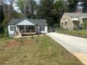 Charming renovated bungalow with new gray siding, a inviting front porch, and freshly landscaped front yard at 1841 Bayberry Sw Dr, Atlanta, GA 30311