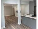 Open floor plan seamlessly connects the updated kitchen with the spacious living area, showcasing new hardwood floors at 1841 Bayberry Sw Dr, Atlanta, GA 30311