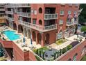 Luxury high-rise featuring a rooftop pool, seating, and beautifully landscaped gardens at 3435 Kingsboro Ne Rd # 603, Atlanta, GA 30326