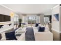 Bright living room with hardwood floors, white sofas, and access to a balcony at 3435 Kingsboro Ne Rd # 603, Atlanta, GA 30326