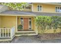 Inviting front entrance with a lovely porch and light-filled sidelights at 103 Nob Hl, Peachtree City, GA 30269