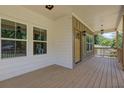 Spacious covered porch with a smooth floor, suitable for creating a comfortable outdoor living space at 158 Hemphill School Rd, Atlanta, GA 30331