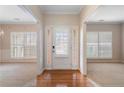 Welcoming foyer with hardwood floors and an abundance of natural light from large windows at 923 Port West Dr, Auburn, GA 30011