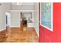 Open-concept living room with hardwood floors and views into the kitchen through the doorway at 1531 Stone Gate Se Ln, Atlanta, GA 30317