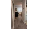 Hallway featuring modern gray flooring leading into the home's living space at 340 Teal Ct, Roswell, GA 30076