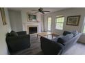 Cozy living room with neutral walls, a fireplace, and access to the outdoors at 340 Teal Ct, Roswell, GA 30076
