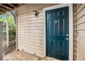 Close-up of unit 306's blue front door with decorative accents and a sidelight at 306 Teal Ct, Roswell, GA 30076