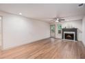 Living room featuring hardwood floors, fireplace, and access to the backyard at 306 Teal Ct, Roswell, GA 30076