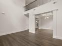 Spacious living room with hardwood floors, coffered ceiling, and an open floor plan at 3760 Near Star Ln, Cumming, GA 30028