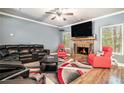 Inviting living room features a fireplace, plush seating, and modern decor at 95 Hawthorn Ln, Covington, GA 30014
