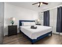 Comfortable bedroom with a queen-sized bed, nightstands, and ample natural light at 215 Piedmont Ne Ave # 708, Atlanta, GA 30308