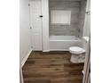Cozy bathroom featuring a tub and shower combo, updated vanity and light-colored walls at 2523 Hood Nw Ave, Atlanta, GA 30318