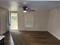 Bright living room with a ceiling fan and a large window to welcome natural light at 2523 Hood Nw Ave, Atlanta, GA 30318
