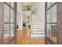 Grand entryway featuring an open staircase and views into the living spaces at 4062 Vinings Mill Se Trl, Smyrna, GA 30080