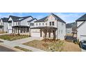 Two-story home boasting a welcoming front porch, a two-car garage, and lush landscaping in a desirable area at 784 Keystone Dr, Woodstock, GA 30188