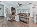 Bright living room with hardwood floors, fireplace, built-ins, and open layout at 1170 Upper Sweetwater Se Trl, White, GA 30184