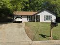 Inviting single-story home with tidy landscaping, long driveway, and traditional design at 5516 Westberry Ln, Norcross, GA 30071