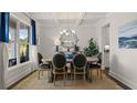 Bright dining room with a coffered ceiling, neutral decor, and large windows at 3790 Near Star Ln, Cumming, GA 30028