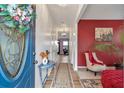 Inviting foyer with a decorative front door and interior featuring stylish decor and bright lighting at 4037 Hill Station Ct, Sugar Hill, GA 30518