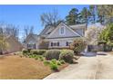 This beautiful home features manicured landscaping, flowering trees, and a private driveway, offering a serene and inviting atmosphere at 4090 Cherry Ridge Walk, Suwanee, GA 30024