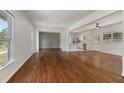 Spacious living room with hardwood floors, neutral walls, and large windows providing natural light at 517 Toombs St, Palmetto, GA 30268