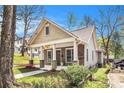 View of a well-maintained home showcasing its classic design and inviting front entrance on a beautiful sunny day at 559 Robinson Se Ave, Atlanta, GA 30315
