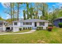 Charming home featuring a landscaped front yard and welcoming entrance at 111 Leathers Circle Nw, Atlanta, GA 30314