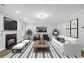 Inviting living room with a fireplace, comfortable seating, and stylish decor for relaxing and entertaining guests at 277 Edison Dr, Stockbridge, GA 30281