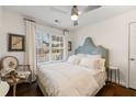 Cozy bedroom featuring a plush bed, soft linens, and natural light at 405 Ballymore Pass, Woodstock, GA 30189
