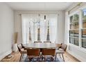 Elegant dining room with modern lighting, large windows, and stylish furniture at 1010 Violet Sw St # A, Atlanta, GA 30310