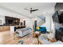 Bright living room features open layout, modern finishes, and seamless flow to kitchen and staircase at 1010 Violet Sw St # A, Atlanta, GA 30310