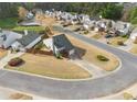 Aerial view of a well-kept home in a quiet neighborhood with mature trees and manicured lawns at 2814 Pine Valley Nw Way, Kennesaw, GA 30152