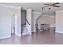 Bright living room featuring hardwood floors, stairs, and plenty of natural light at 1147 Laurel Valley Ct, Buford, GA 30519