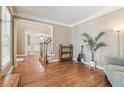 Sitting room with hardwood floors, a comfortable chair and a plant at 2130 Hollowbrooke Nw Way, Acworth, GA 30101