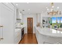 Kitchen showcasing marble countertops, white cabinetry, and stainless steel appliances at 3300 Windy Ridge Se Pkwy # 1501, Atlanta, GA 30339
