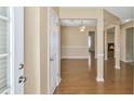 Welcoming entryway with hardwood floors leading to a spacious dining area and cozy fireplace at 8849 Seneca Rd, Palmetto, GA 30268