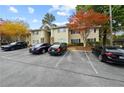 Condo with ample parking for residents and visitors, landscaping, and cozy exterior at 1468 Briarwood Ne Rd # 810, Brookhaven, GA 30319
