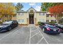 Inviting two-story condo with stone accents, well-maintained landscaping, and dedicated parking at 1468 Briarwood Ne Rd # 810, Brookhaven, GA 30319