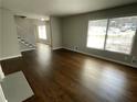 Spacious living room with hardwood floors, large windows, and a view of the front yard at 3467 Valley Ridge Sw Ter, Atlanta, GA 30331