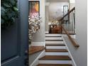Inviting entryway with hardwood stairs, leading into the living space and decorated with a decorative vase at 62 Emerson Hill Sq, Marietta, GA 30060
