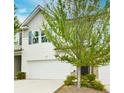 Beautiful townhome with large garage and well-maintained landscaping, inviting and appealing at 5522 Donerail St, Lithonia, GA 30058