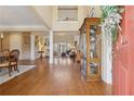 Elegant entryway featuring hardwood floors, a view to the living room, and a grand staircase, creating a welcoming atmosphere at 6840 N Creekside Pt, Cumming, GA 30041
